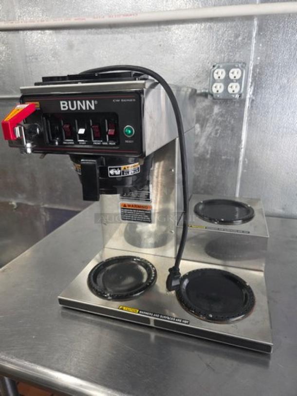 Bunn CWTF15 automatic coffee brewer, 3 warmers, hot water faucet, 120V. Stainless steel, good condition with visible labels.