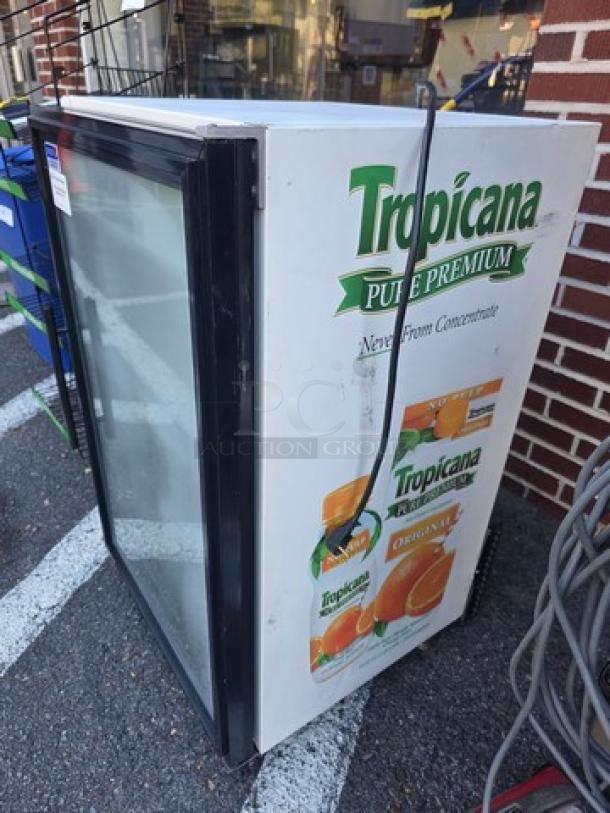 True GDM-07 countertop glass door refrigerated merchandiser; features Tropicana branding; good condition.