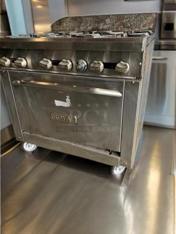 Royal Range RR-6, 6-burner gas range with oven, stainless steel, natural gas, labeled "ROYAL." Outstanding condition, fully tested.