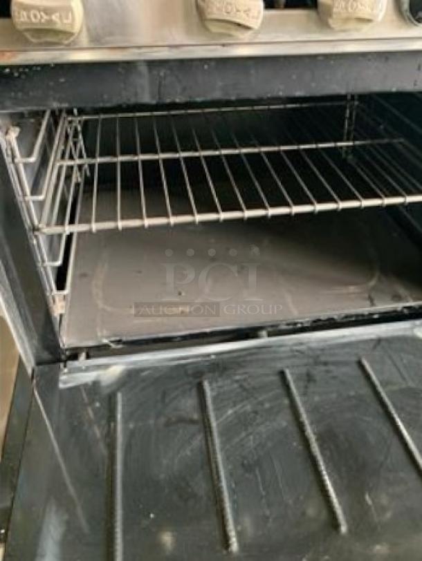 Royal Range RR-6 gas range, 6 burners, natural gas, open oven with racks, outstanding condition, fully tested and working.
