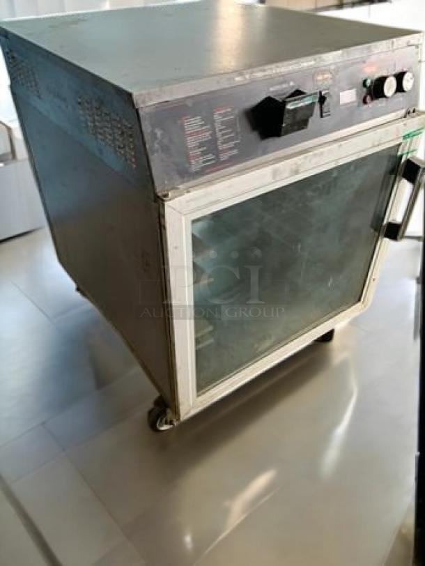 Hatco FSHC-6W2 Flav-R-Savor Heated Holding Cabinet, superb condition, pass-through, 120V, fully tested, glass doors, on wheels.