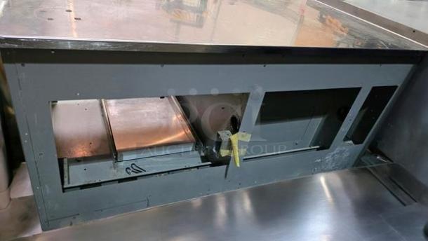 Stainless steel workstation cabinet by Custom Commercial Fabrication, with built-in power outlets, pull-out tray, superb condition.