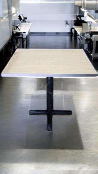Square wooden dining table with black cast-iron base, fantastic condition, custom commercial furniture, 8 available.