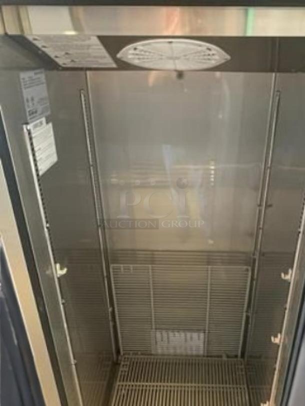 Turbo Air EF24-1-N-V single solid door upright freezer, pristine condition, 115V, tags indicate model and specifications.