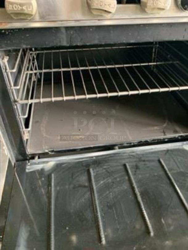 Royal Range of California RR-6-C 36" gas range, featuring 6 burners and a convection oven. Superb condition. 210,000 BTU.