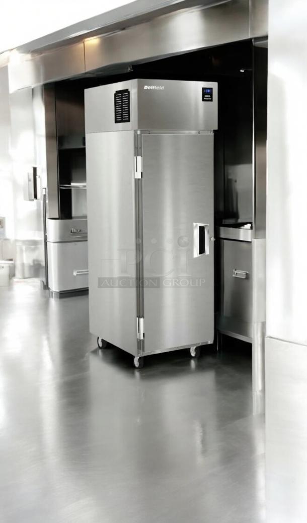 Superb condition Delfield 6125XL-S single door reach-in freezer, 115V, fully tested and working, located in stainless steel kitchen.