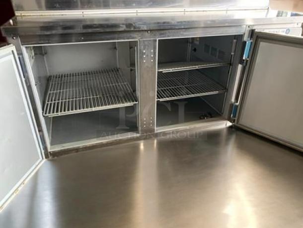 Beverage-Air DP67 67" pizza prep table, stainless steel, refrigerated base, excellent condition, two-section shelving.