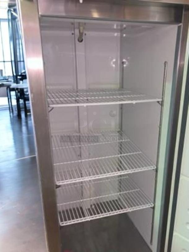 Kintera KBM1F single door upright commercial freezer, superb condition, 115V, fully tested, featuring three wire shelves.