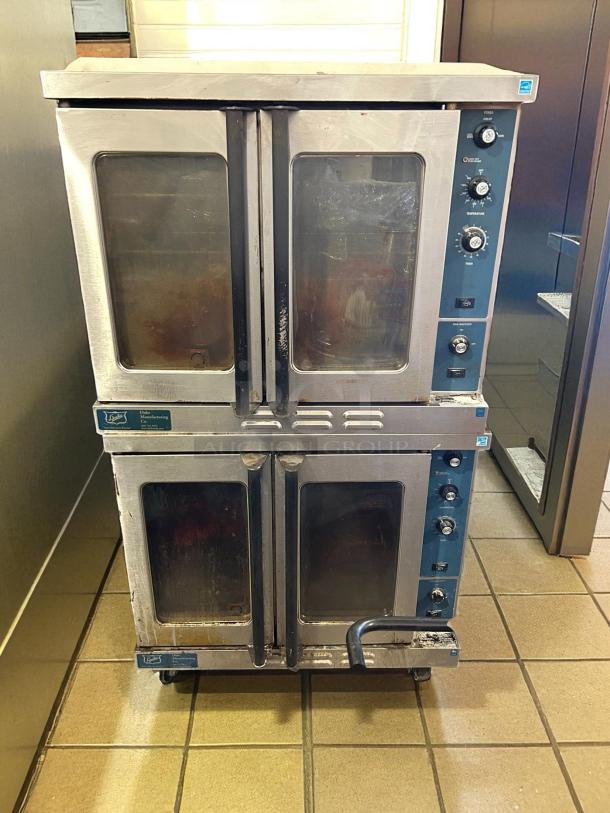 Duke E102-G double full-size natural gas convection oven, 40,000 BTU, tested and working, visible wear, stainless steel finish.