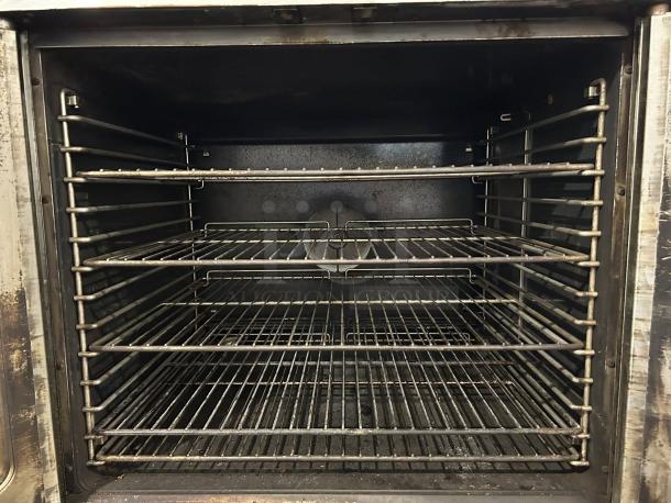 Duke E102-G double full-size natural gas convection oven, 40,000 BTU, tested and working, showing interior racks.
