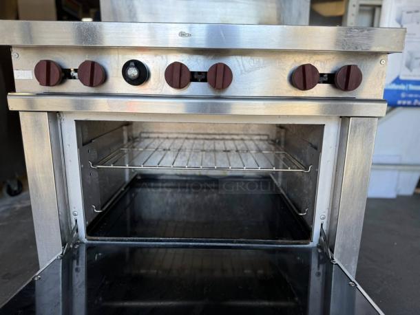 Wolf WX36-6BN 36" 6 Burner Gas Range, excellent condition, natural gas, standard oven, visible control knobs, tested working.