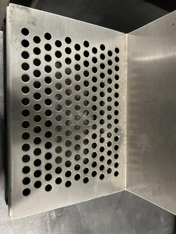 Metallic perforated panel detail of Curtis GSG-3BLK coffee grinder in excellent condition. Suitable for 2 1/2 lb hopper.