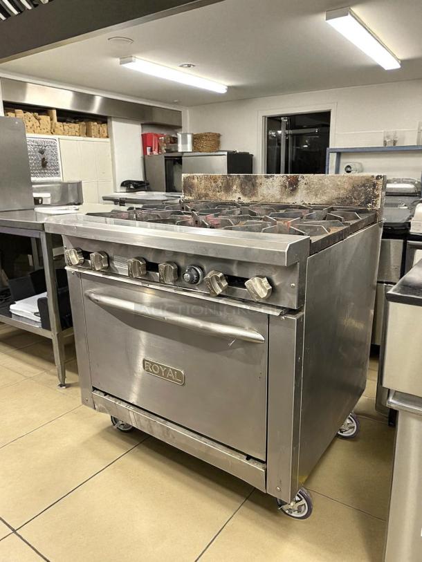 Royal Range RR-6 commercial gas range with 6 burners, 36" width, excellent condition, stainless steel, on casters.