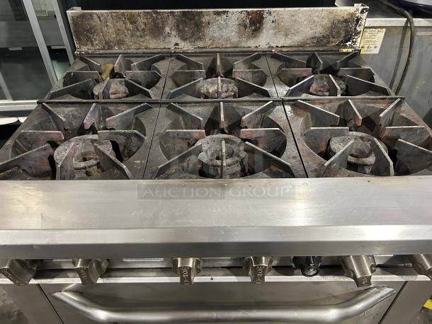 Royal Range RR-6 commercial 6-burner 36" gas range in excellent condition, tested and working, stainless steel finish.