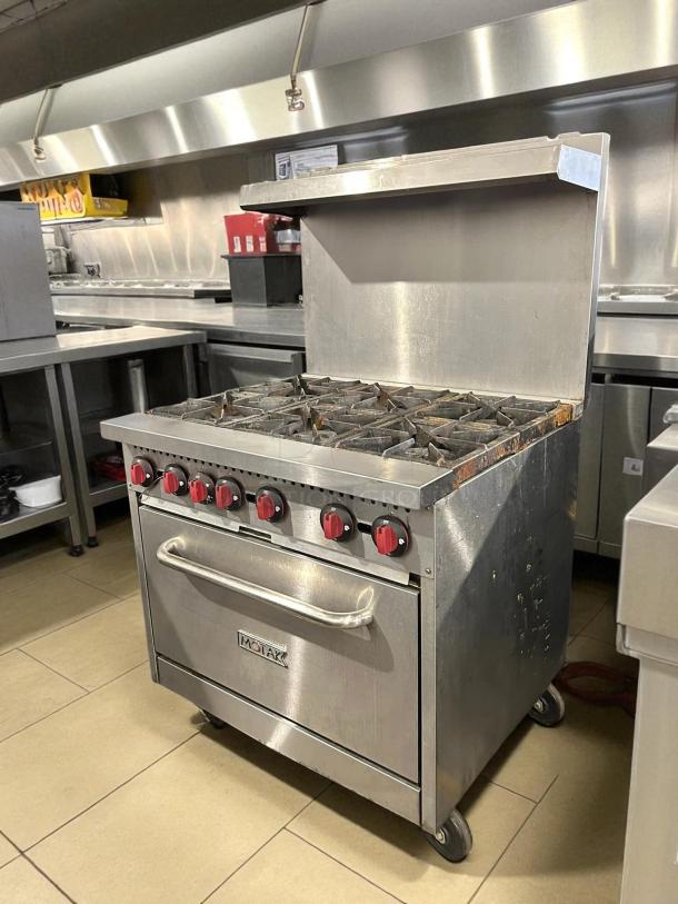 MoTak MR6-C-S 36" gas range with 6 burners and standard oven. Great condition, tested and working. Red knob controls.