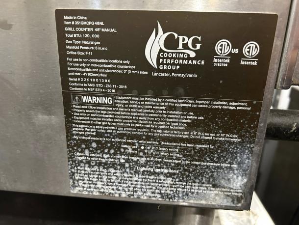 Cooking Performance Group GM-CPG-48-NL gas griddle label showing specs: 48", 120,000 BTU, natural gas, tested and working.