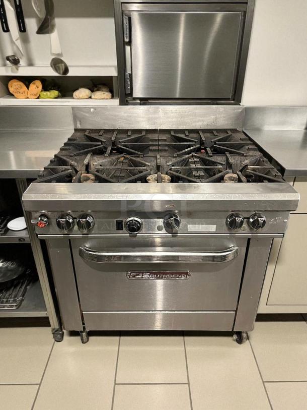 Southbend S36D gas restaurant range, 36", 6 burners, standard oven, stainless steel, excellent condition, tested and working.