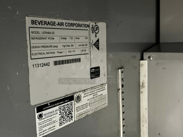 Beverage Air UCR48A undercounter refrigerator label showing model, refrigerant details, and electrical ratings.