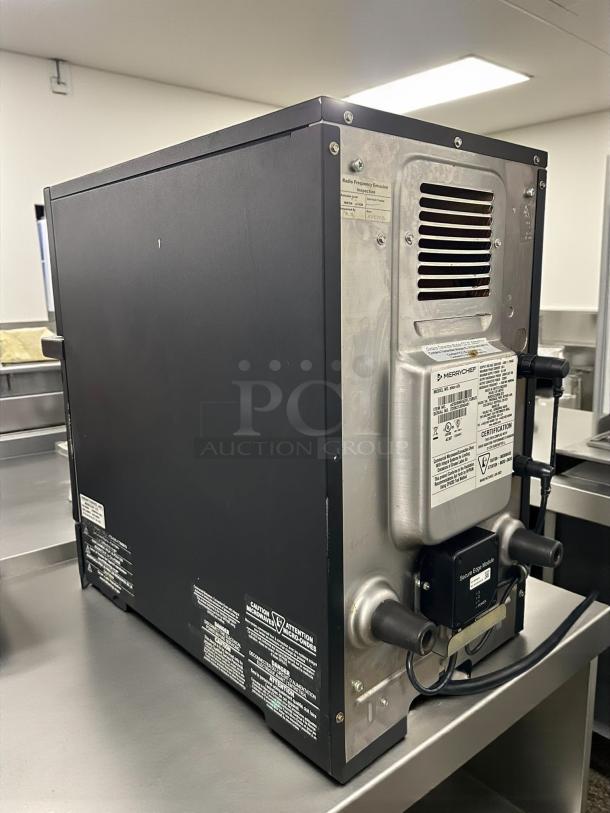 Merrychef eikon E1S high-speed countertop microwave convection oven in tested working condition, 208-240v/1ph, rear view.