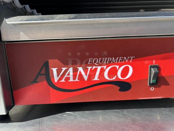 Avantco RG1830NS hot dog roller grill, 11 non-stick rollers, 120V, excellent condition, red exterior, power switch visible.