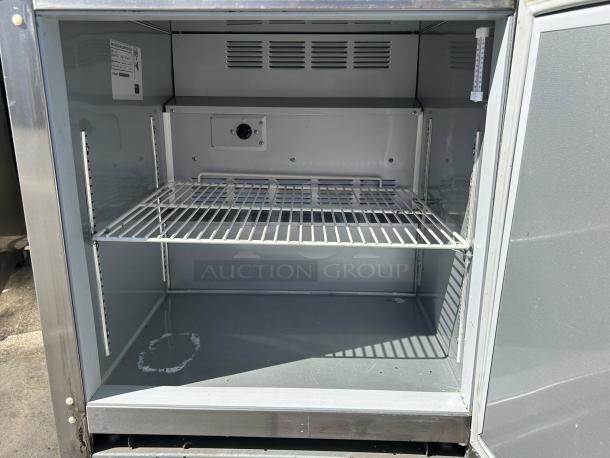 Beverage Air UCR27A 27" undercounter refrigerator in excellent condition, interior view, one shelf, tested and working.