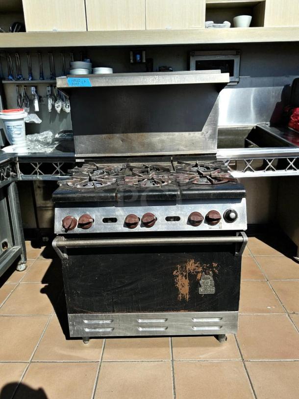 WOLF Commercial 6 Burner Range and Oven, natural gas, excellent condition, tested and working, visible wear on front panel.