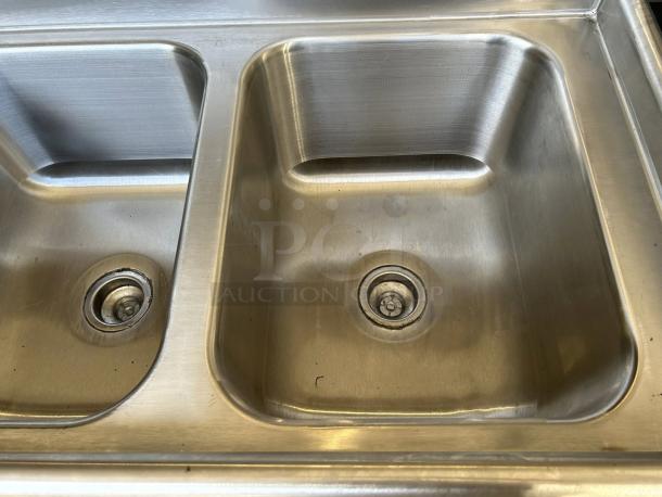 Advance Tabco T9-3-54 stainless steel three-compartment sink in excellent condition, commercial-grade, with clean basins.