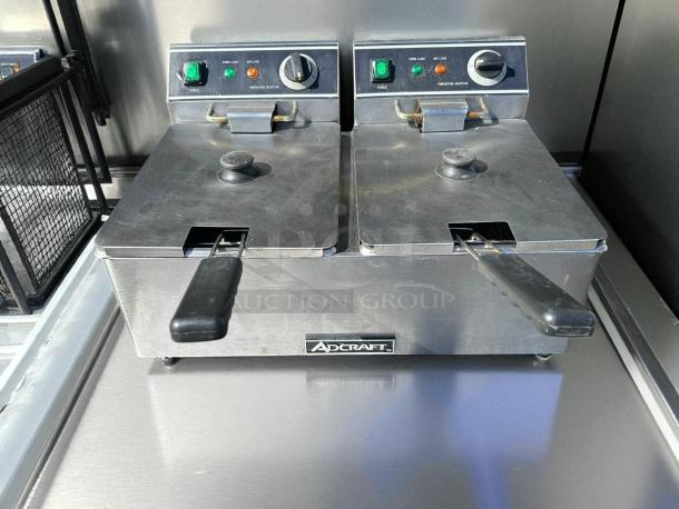 Adcraft DF-6L/2 double tank deep fryer in stainless steel, tested and working. Features power and heat light indicators.