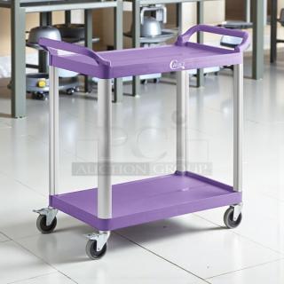 Brand new Choice purple utility cart with two shelves, sturdy handles, and smooth-rolling wheels. Ideal for bussing tasks.