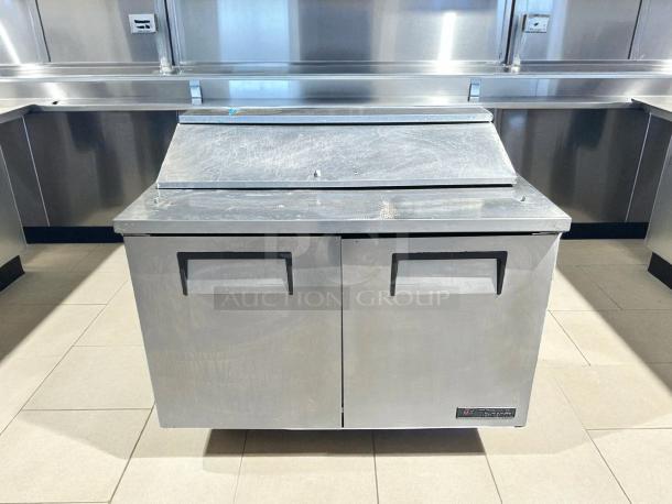 True TSSU-48-12-HC refrigerated sandwich prep table, 48 3/8", two-door, tested and working, stainless steel exterior.