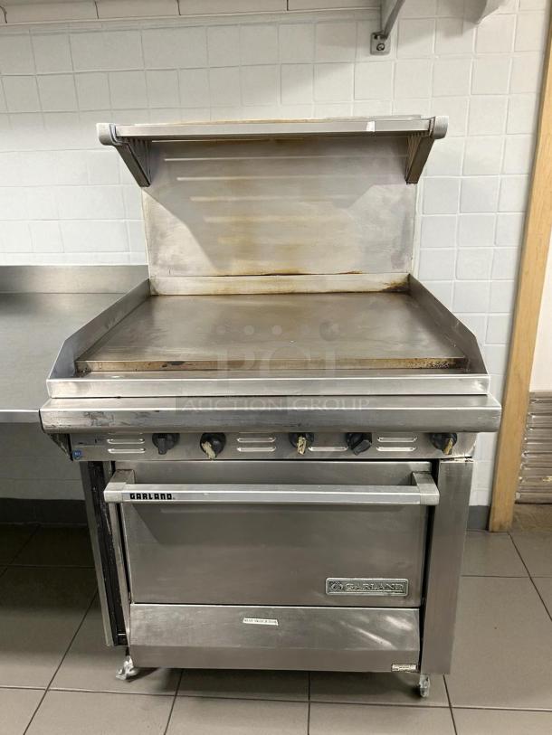 Garland G36-G36R 36" gas range, stainless steel, full griddle, standard oven, natural gas, excellent condition, tested.