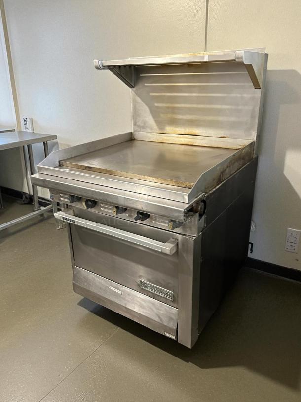 Garland G36-G36R 36" gas range, full griddle, standard oven, natural gas, excellent condition, tested and working.