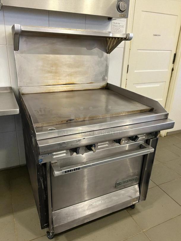 Garland G36-G36R 36" gas range with full griddle and standard oven in excellent condition, natural gas, tested and working.
