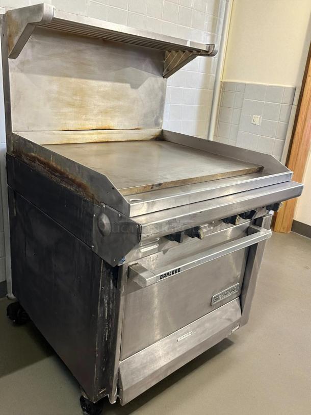 Garland G36-G36R 36" gas range with full griddle and standard oven, in excellent condition. Tested, natural gas.
