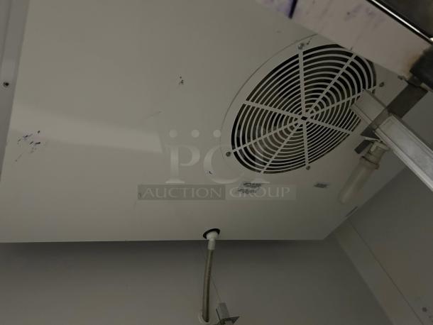 True T-49-HC reach-in refrigerator interior. Visible fan, vent, and light fixture. Tested and working condition.