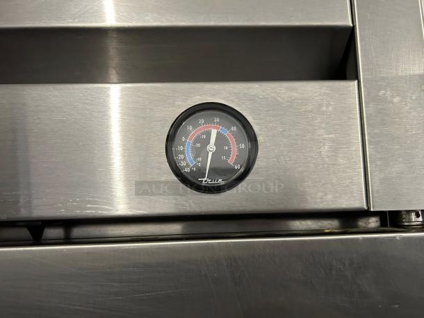 True T-49-HC reach-in refrigerator, solid door, stainless steel with visible temperature gauge, tested and working.