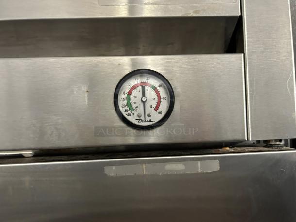 True T-49-HC refrigerator in excellent condition, features solid doors and a visible thermometer gauge. Tested and working.