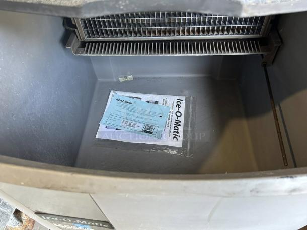 Ice-O-Matic ICEU220HA cube ice maker, undercounter style, in working condition. Includes visible manual and labeling.