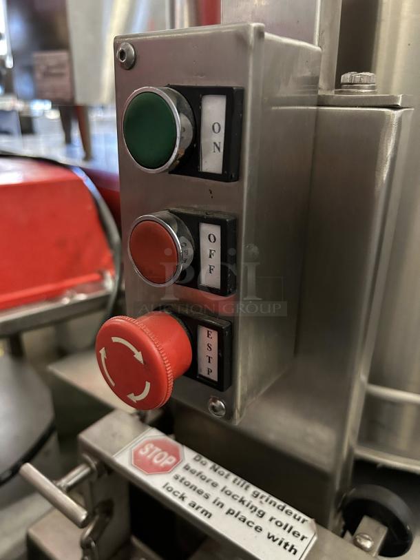 CocoaTown ECGC-65A-AV cacao grinder control panel with on/off buttons, red emergency stop, and safety label.