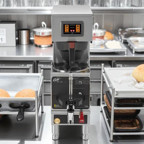 Curtis G4GEMS63A1000 automatic coffee brewer, 1.5 gal capacity, touchscreen, tested and working, clean condition.