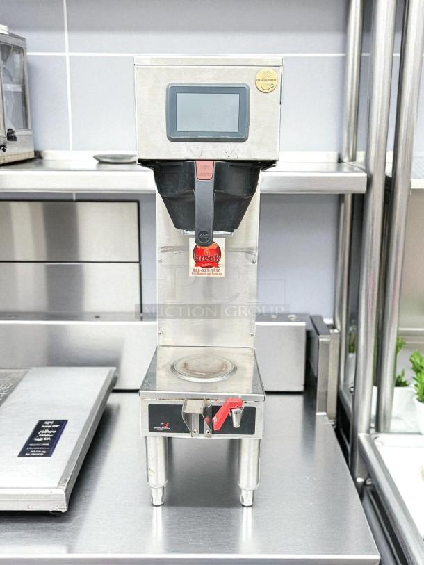 Curtis G4GEMS63A1000 automatic satellite coffee brewer with 1.5-gal capacity, touchscreen display, and dispenser; excellent condition.
