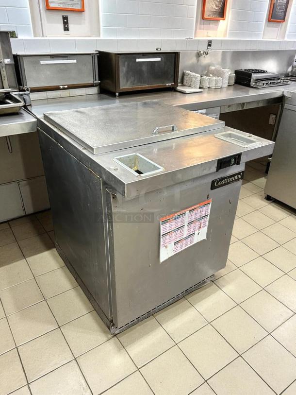 Continental SW27N12M 27" 1-Door Mega Top Refrigerated Sandwich Prep Table in good condition, tested working, visible label.