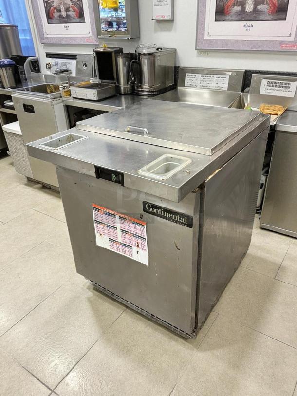 Continental SW27N12M 27" 1-Door Mega Top Sandwich Prep Table, holds (12) 1/6 pans, stainless steel, tested, working condition.