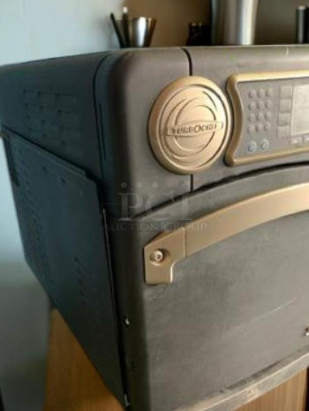 TurboChef NGo high-speed oven, excellent condition, 208/240V, fully tested, branded panel, sleek black and gold design.