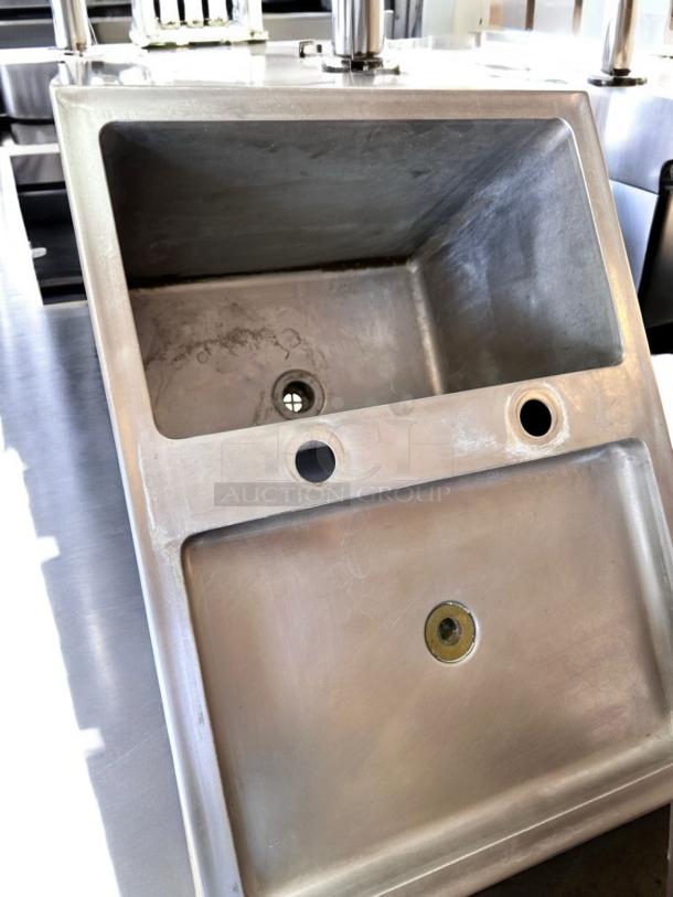 Commercial heavy-duty triple compartment stainless steel sink with dual drainboards, superb condition, fully tested.