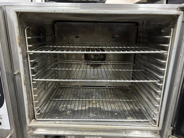 Blodgett BCX-14E combi oven and steamer, interior view, showing four wire racks, tested and working condition.