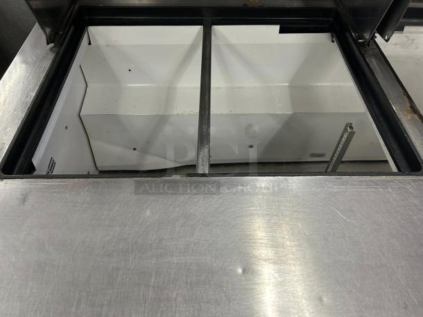 True TSSU-60-24M-B-ST-HC sandwich/salad unit, excellent condition, open top view showing internal compartments, hydrocarbon refrigerant.