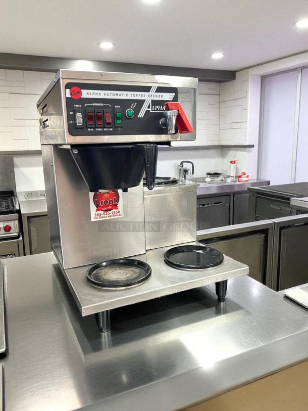 Curtis Alpha 3DR Coffee Brewer in great condition with 3 lower warmers, 120/220V, tested and working, control labels visible.