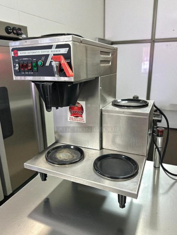 Curtis Alpha 3DR coffee brewer with three lower warmers, stainless steel, 120/220V, tested working, excellent condition.