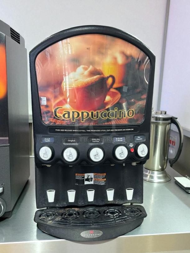 Grindmaster PIC5 beverage dispenser in excellent condition, features five flavors, tested and working, includes cappuccino branding.
